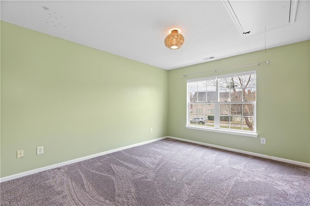 unfurnished room featuring carpet