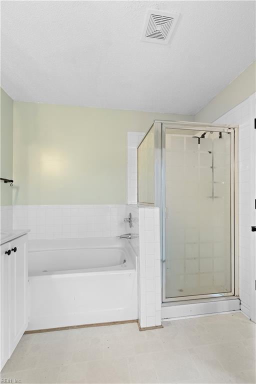 bathroom with independent shower and bath