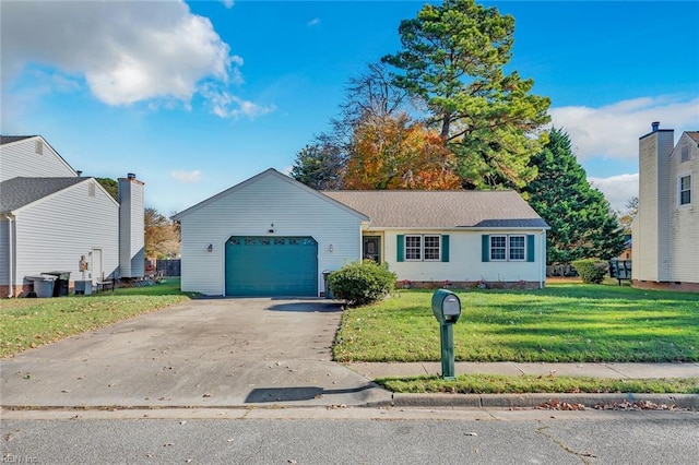 view of front of house featuring a garage and a front lawn