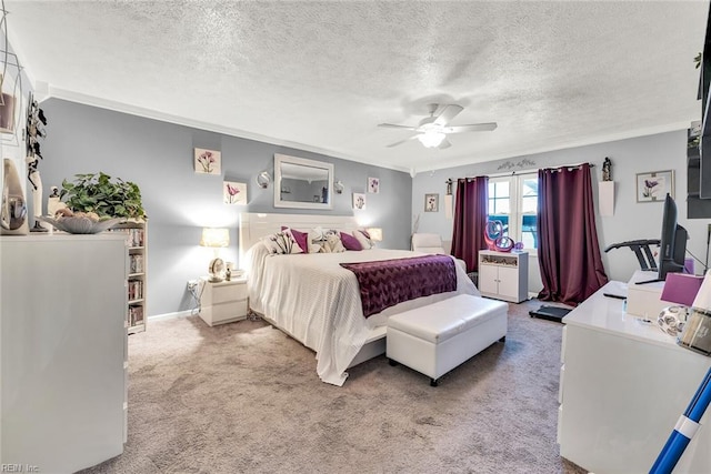 carpeted bedroom featuring ceiling fan, crown molding, and a textured ceiling