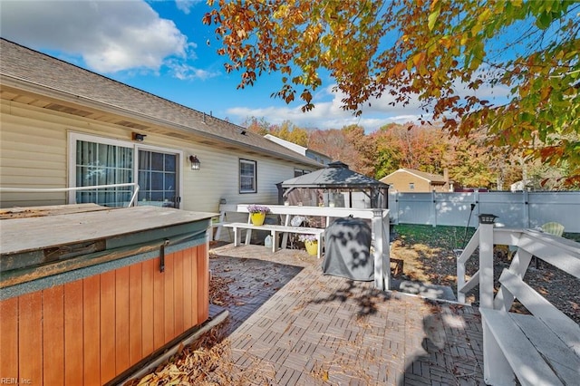 view of patio / terrace with a gazebo and a hot tub