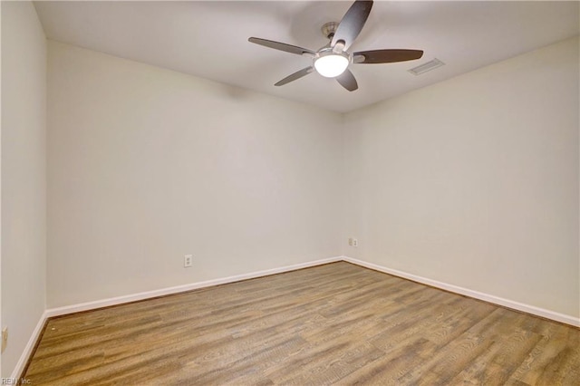 unfurnished room with ceiling fan and light wood-type flooring