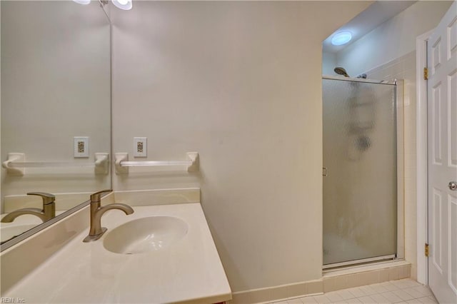 bathroom with vanity, tile patterned floors, and a shower with shower door