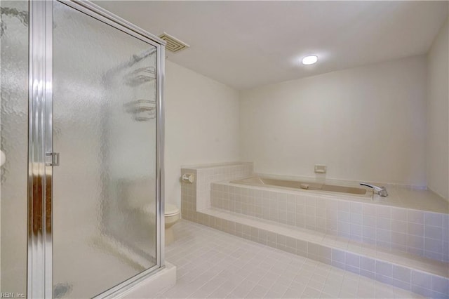 bathroom with tile patterned flooring, toilet, and independent shower and bath