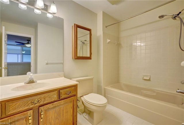 full bathroom with tile patterned flooring, tiled shower / bath, vanity, and ceiling fan