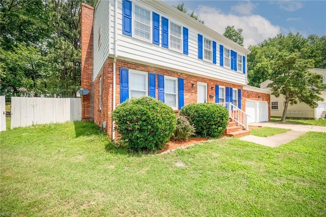 view of front of home with a garage and a front lawn