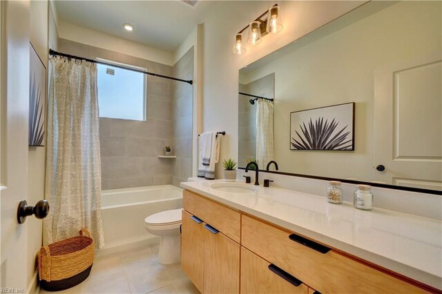 full bathroom with tile patterned floors, vanity, shower / bath combination with curtain, and toilet