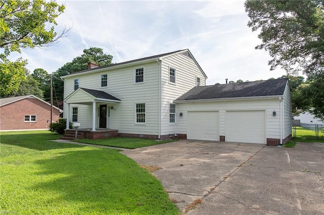 view of front of house with a front lawn and a garage