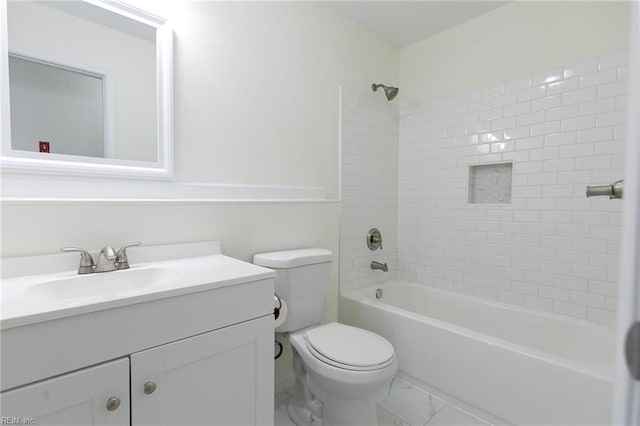 full bathroom featuring vanity, toilet, and tiled shower / bath