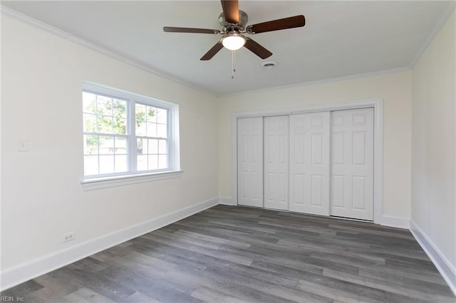 unfurnished bedroom with dark hardwood / wood-style floors, ceiling fan, and crown molding