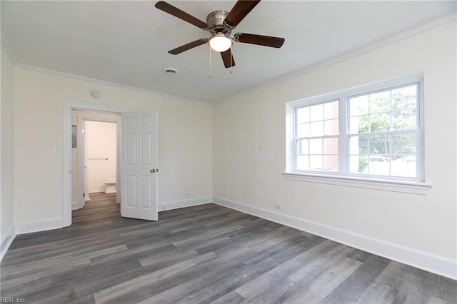 unfurnished bedroom with dark hardwood / wood-style floors, ceiling fan, and crown molding