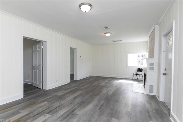 unfurnished room featuring dark hardwood / wood-style floors and crown molding