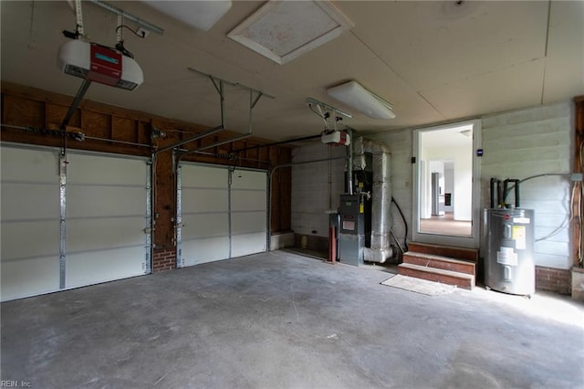 garage featuring water heater and a garage door opener