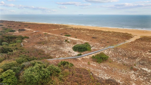 aerial view with a water view and a beach view