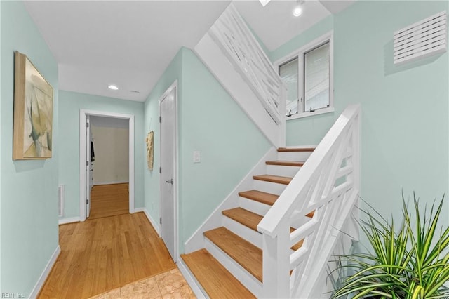 stairway with wood-type flooring