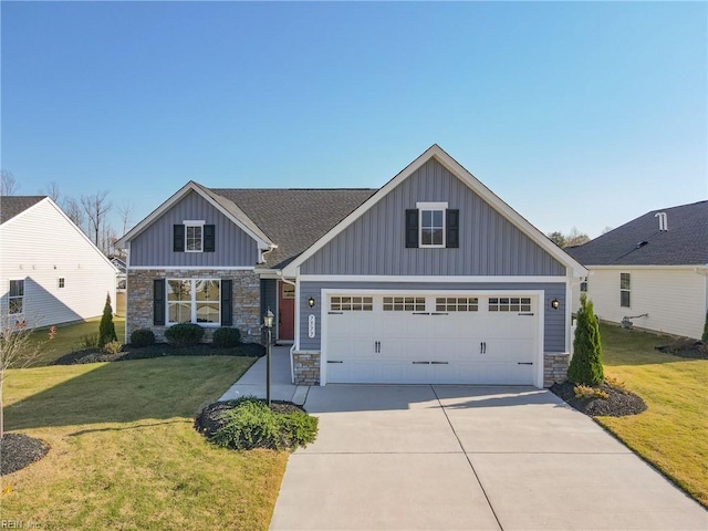 craftsman-style house with a garage and a front lawn