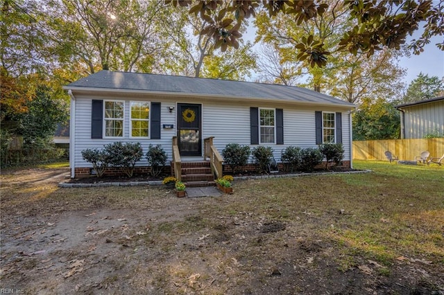 ranch-style home with a front yard