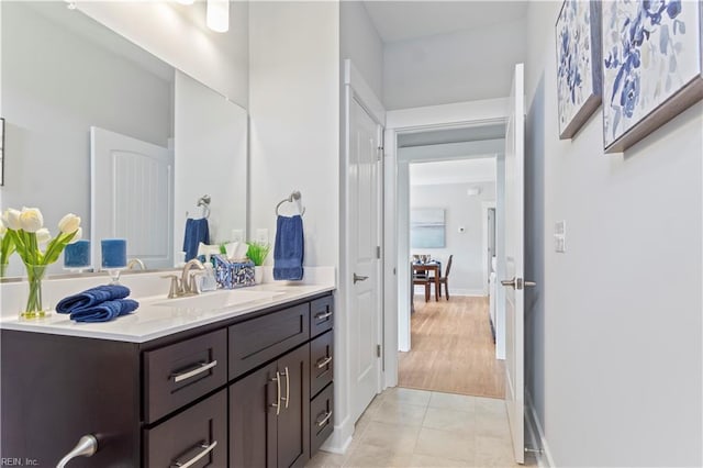 bathroom with hardwood / wood-style floors and vanity