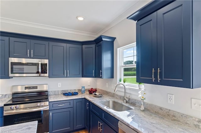 kitchen with blue cabinetry, sink, light stone countertops, and stainless steel appliances