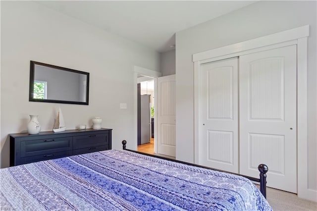 carpeted bedroom featuring a closet