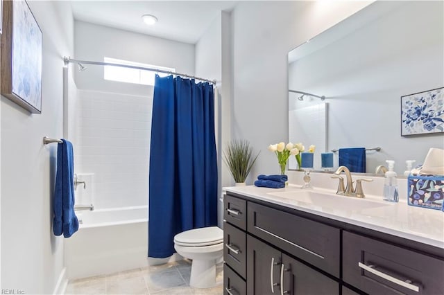 full bathroom with tile patterned flooring, vanity, toilet, and shower / bath combo with shower curtain