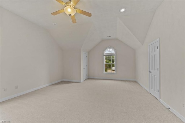 bonus room with light carpet, ceiling fan, and lofted ceiling