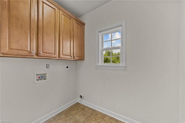 laundry area featuring cabinets, washer hookup, light tile patterned floors, and hookup for an electric dryer