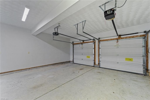 garage featuring a garage door opener