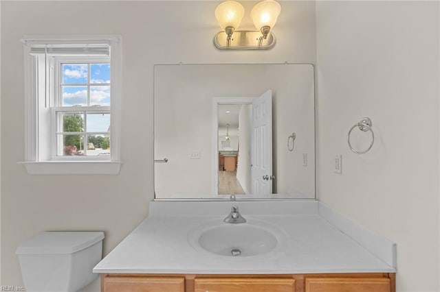 bathroom with vanity and toilet