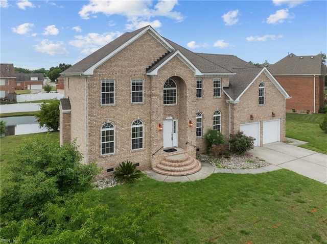 view of front of house featuring a front lawn and a garage