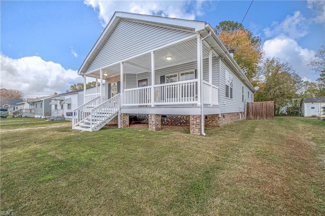 view of front of home featuring a front yard and a porch