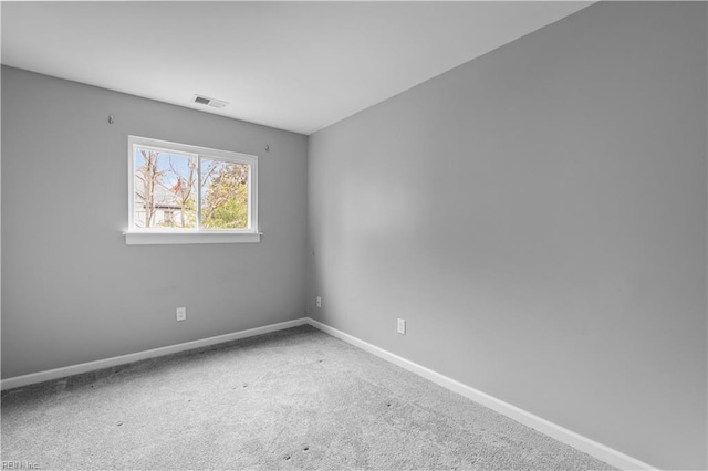 unfurnished room with carpet flooring