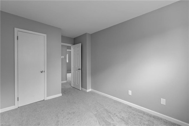 unfurnished bedroom with light carpet