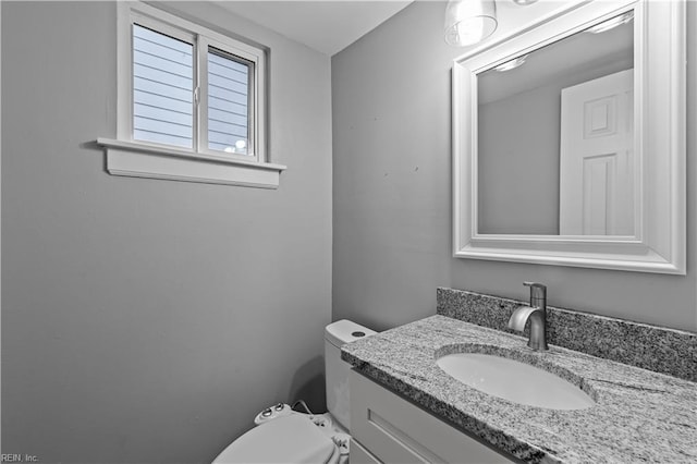 bathroom with vanity and toilet