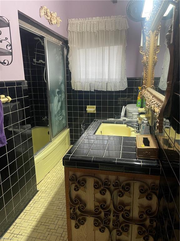 bathroom featuring tile walls and tile patterned flooring