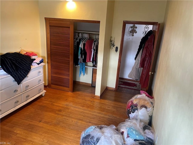 bedroom featuring hardwood / wood-style floors and a closet