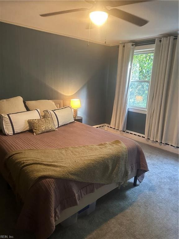 bedroom with ceiling fan and carpet floors