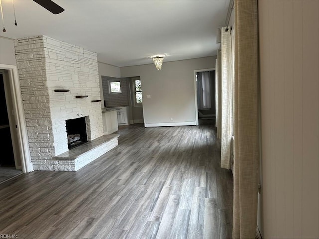 1049 Brandon Ave, Norfolk, VA 23507 - unfurnished living room with ceiling fan, wood finished floors, and a stone fireplace