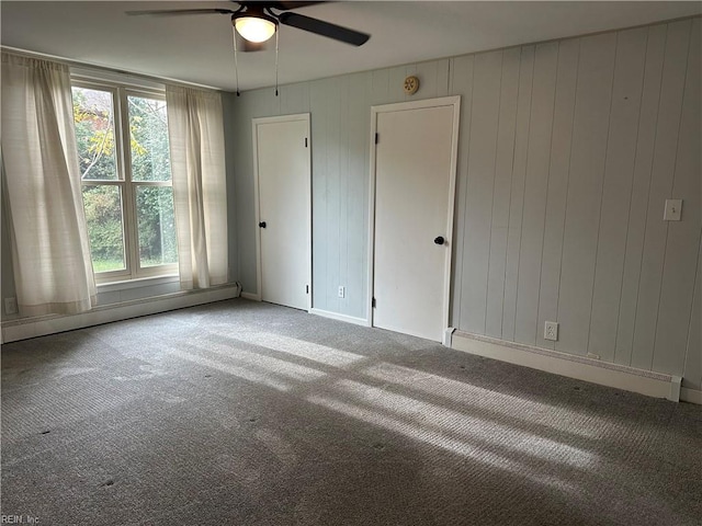 1049 Brandon Ave, Norfolk, VA 23507 - unfurnished bedroom with carpet, multiple windows, a baseboard radiator, and a ceiling fan