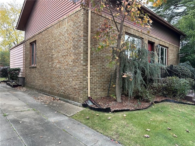 1049 Brandon Ave, Norfolk, VA 23507 - view of property exterior with brick siding and a lawn