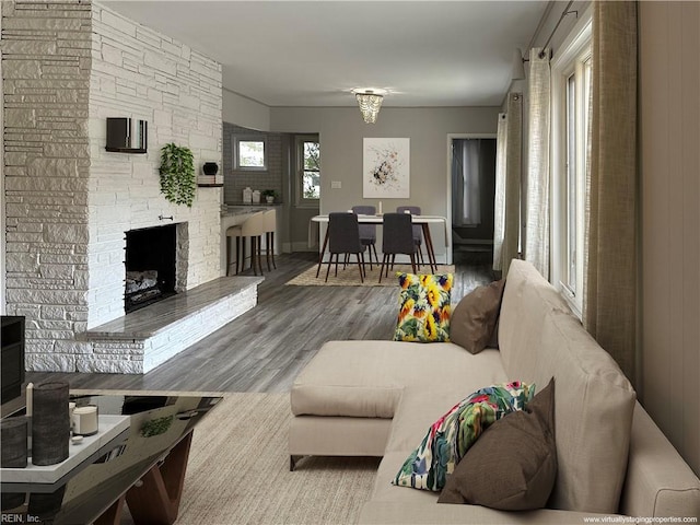 1049 Brandon Ave, Norfolk, VA 23507 - living area with wood finished floors and a stone fireplace