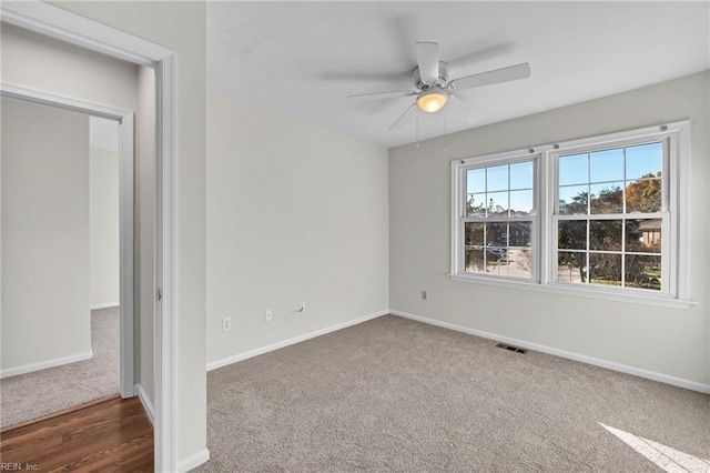 unfurnished room featuring hardwood / wood-style floors and ceiling fan