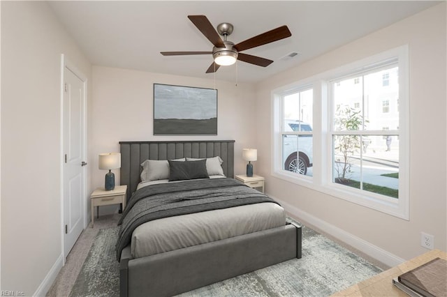 carpeted bedroom featuring ceiling fan