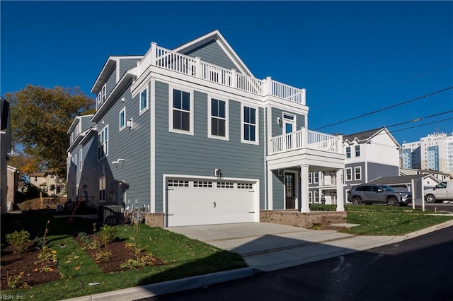 view of front of house featuring a balcony and a garage