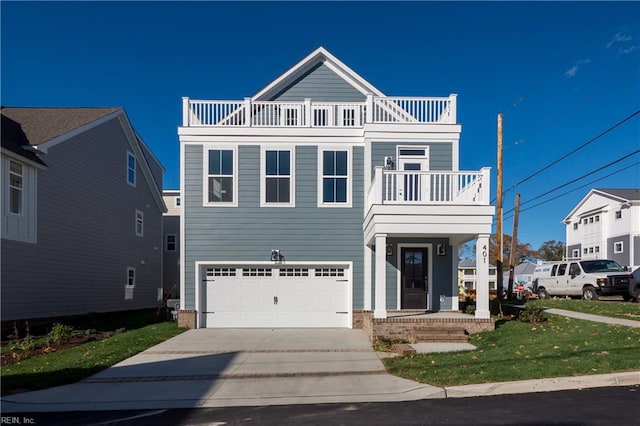 view of front facade with a balcony, a front lawn, and a garage