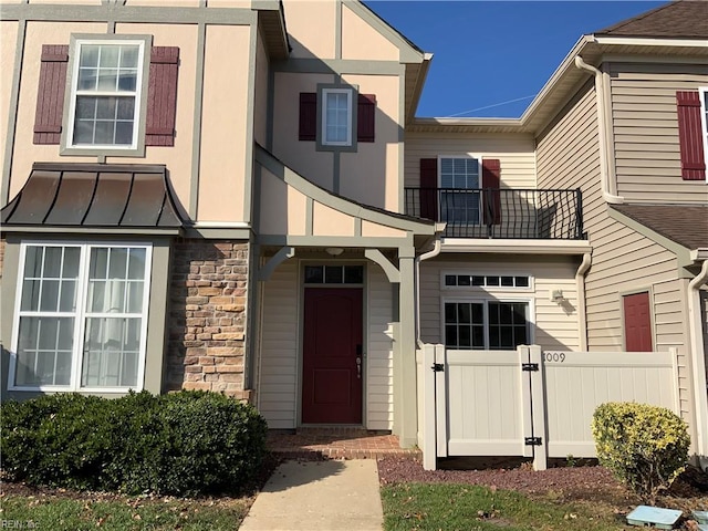 view of front of property with a balcony