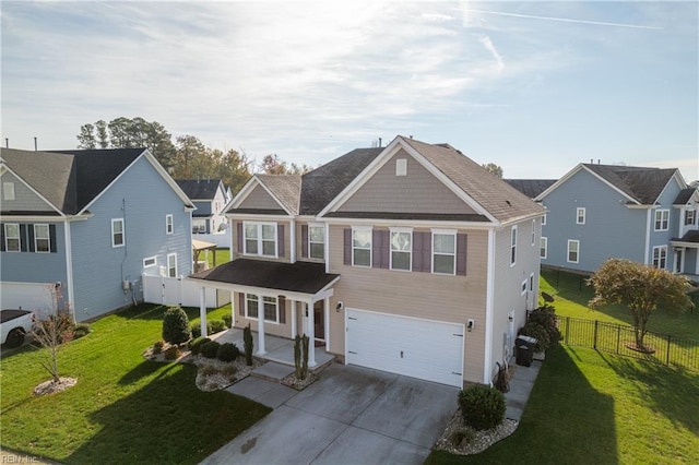 view of front of property with a front yard and a garage