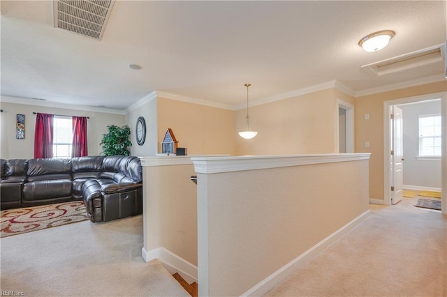 hallway featuring light carpet and ornamental molding