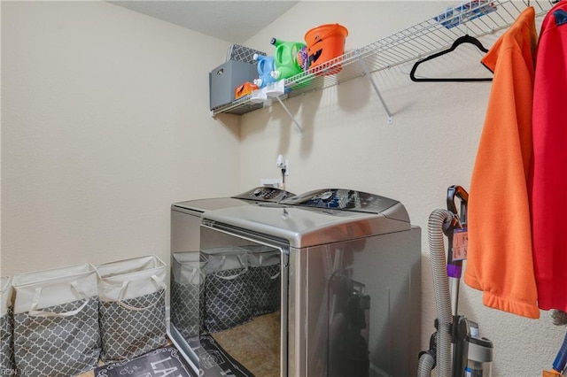 washroom with independent washer and dryer