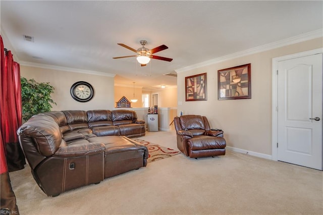 living room featuring light carpet, ceiling fan, and crown molding